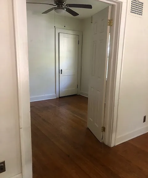View of first downstairs bedroom from the living room
