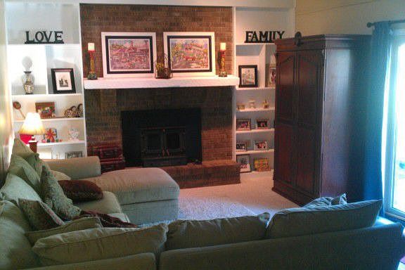 large family room with fireplace and built ins