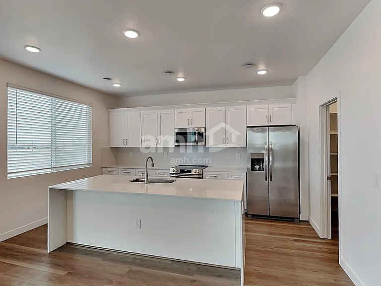 6975 N 125th Dr — Photo 3