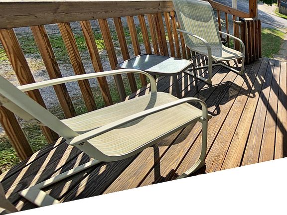 Furnished front porch with additional chairs