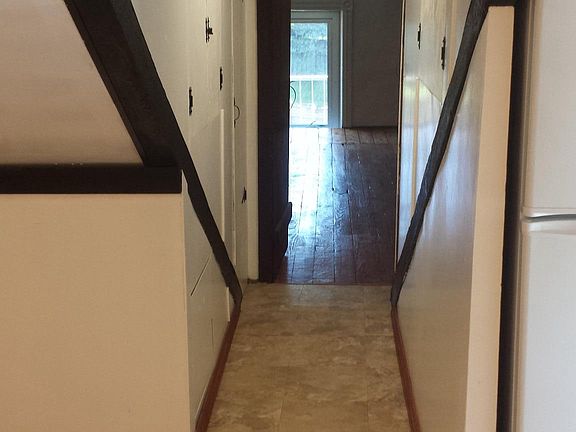 Hall with storage heading back to 2nd bedroom