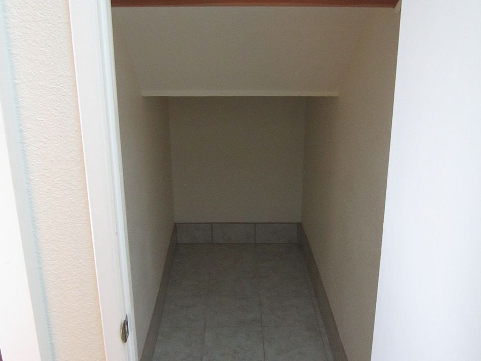 Very generous under the stairwell storage area on right as you walk down hallway to living room