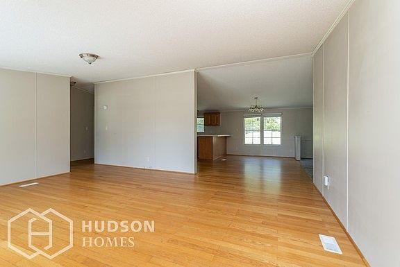 Hudson Homes Management - Living Room with view of Dining Room