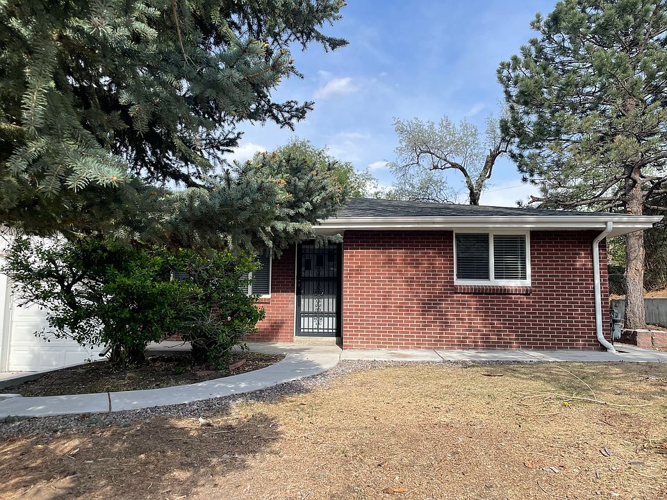 front entry with large trees and path