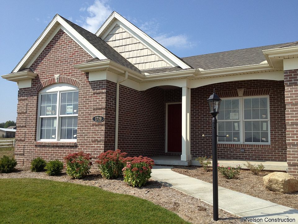 The Villas at Whisper Meadow offer an attractive brick front elevation with shake shingle accents in