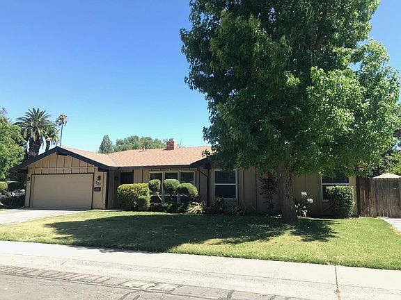 Front of house with side gate into private backyard