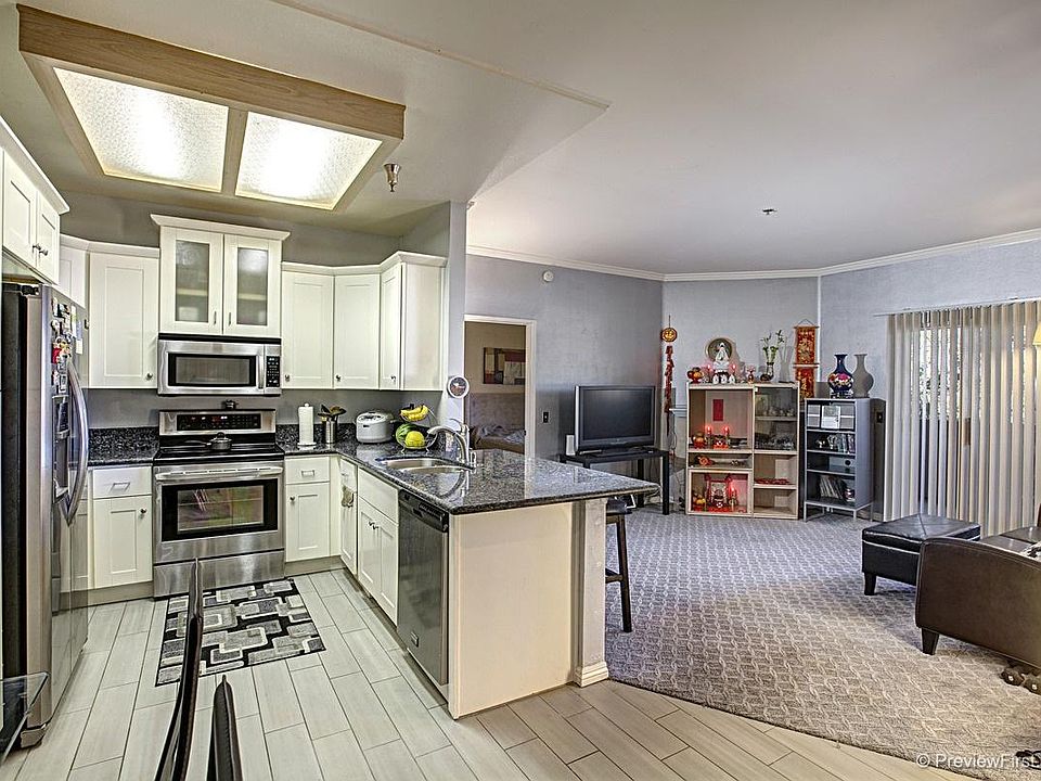 Totally updated kitchen with high end cabinets, granite tops and high end appliances. Family room with high end carpet.