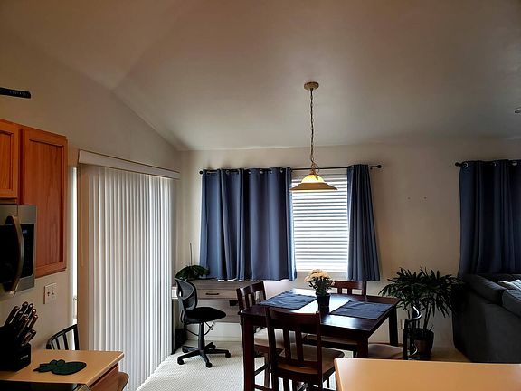 Dining room with dining table and work desk
