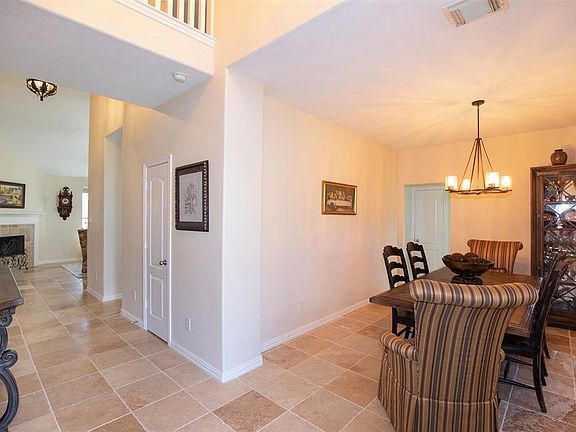 As you enter the home you are greeted with beautiful tile flooring and a grand two-story entryway.
