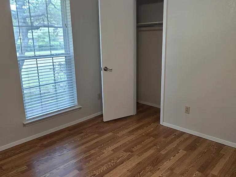 guest bedroom with new ceiling fan and new flooring