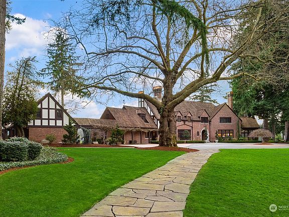 Welcome Acres was built in the 1930's for the Hickcox family during the Great Depression. John S. Baker, a prominent business owner and State Senator, then acquired the estate. Home is Grandfathered in to pump water from the lake to irrigate the entire lawn. Irrigation system was updated by the previous owners and can be controlled by your phone.>