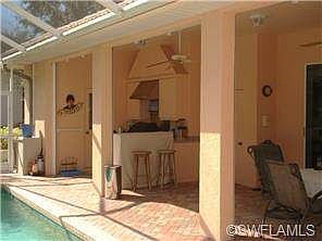 OUTDOOR KITCHEN W/OVERHEAD EXHAUST, ICE MAKER, REFRIG