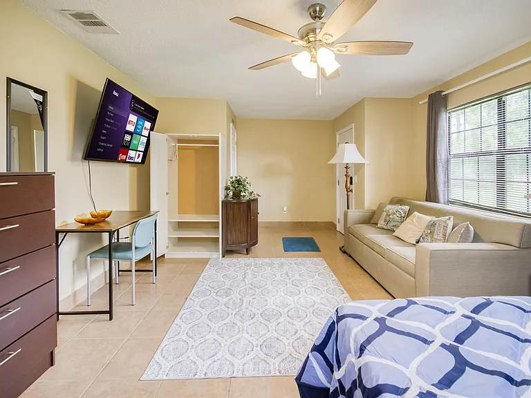 4 large windows with view of the front and side of house, corner room with private entrance!