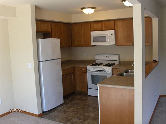 Kitchen with gas range, microwave oven, and refrigerator