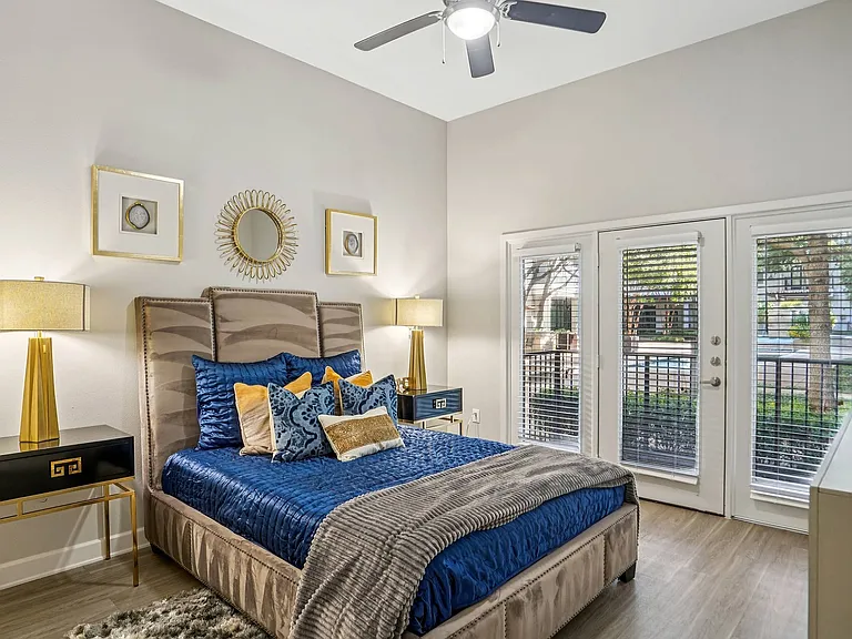A bright and airy bedroom at Addison Keller Springs provides the perfect retreat in Addison, TX.