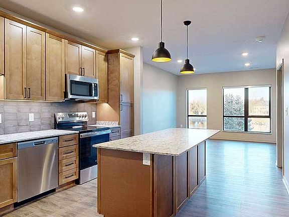 Host in style with a spacious kitchen island and open-concept layout perfect for entertaining.