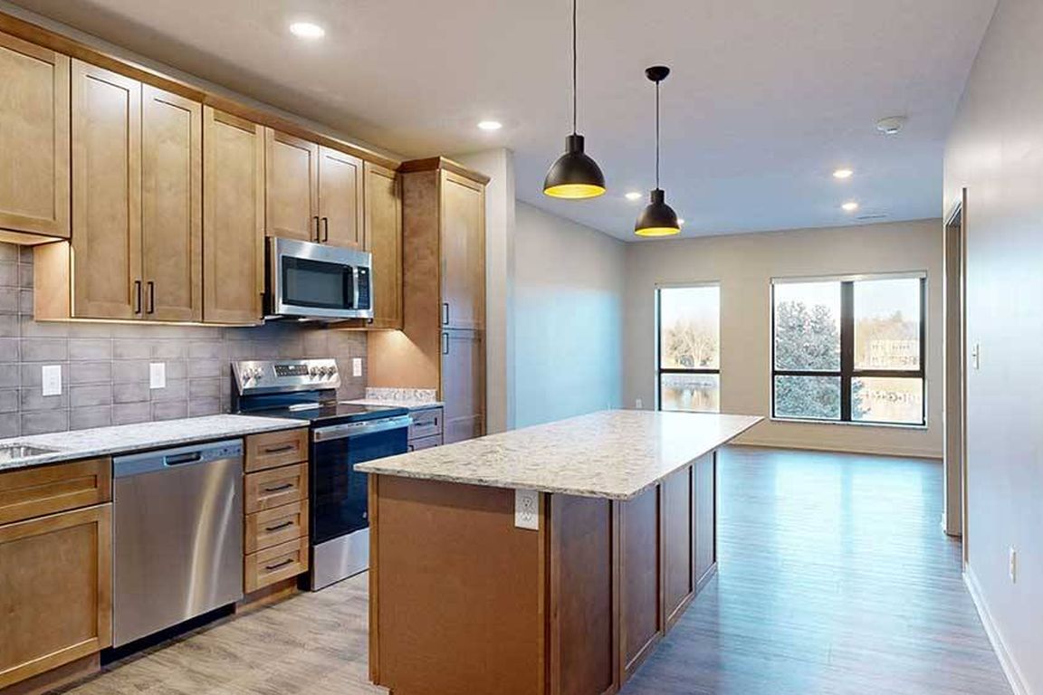 Host in style with a spacious kitchen island and open-concept layout perfect for entertaining.