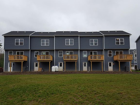 Back of unit; 101 Amicus Dr is on the far left, and 109 Amicus Dr is on the far right.