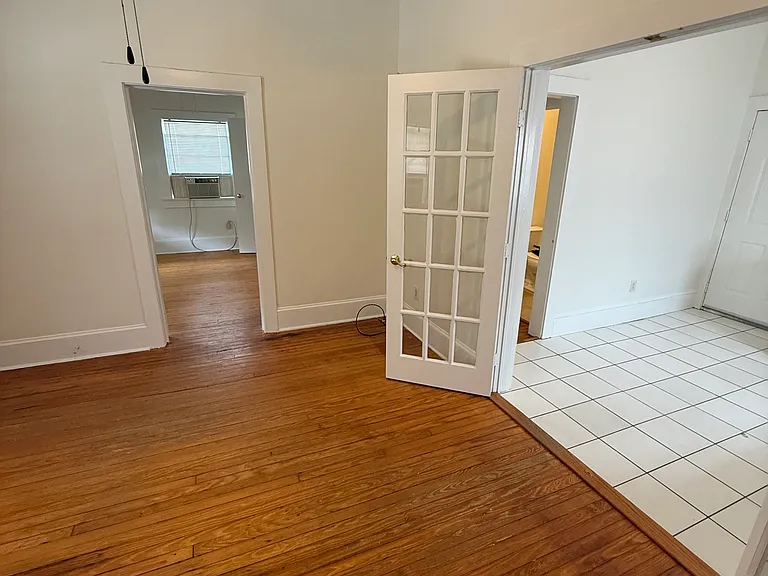 view from living room to front bedroom and kitchen.