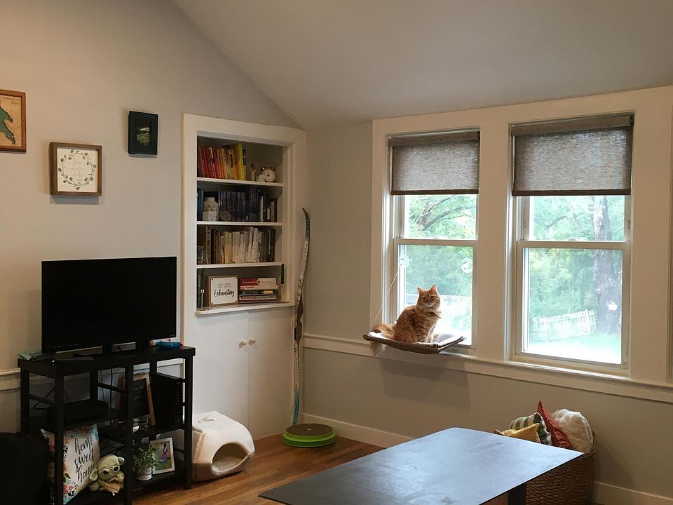 Living room has high ceiling with recessed lighting and new ceiling fan.