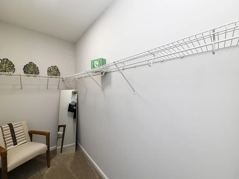 Generous closet space with built-in shelving