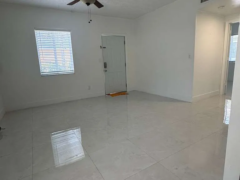 Family Room (view from the Kitchen to the front door)