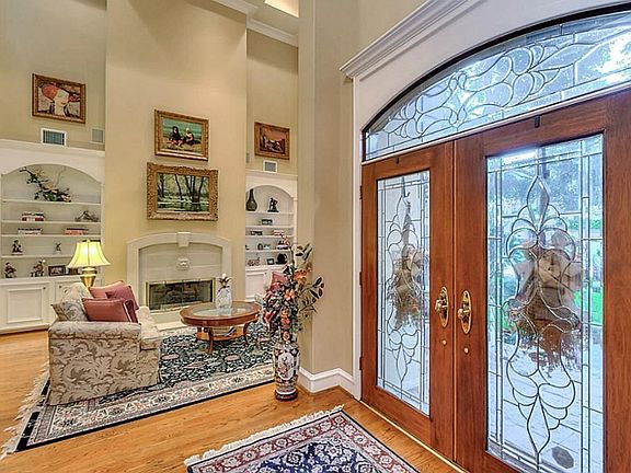 The formal Dining and Living rooms flank the Entry. This picture showcase the Living Room just to the right as you enter the home.