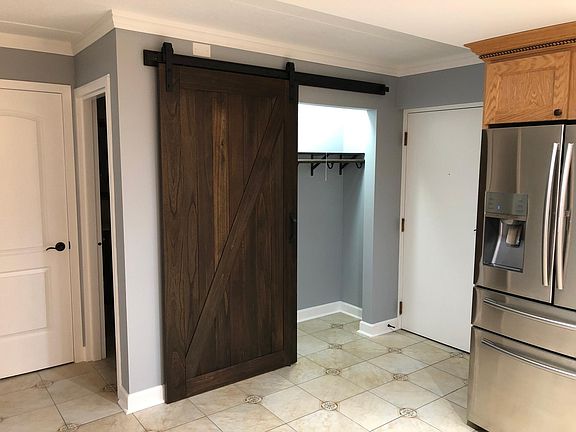 Coat closet with barn door.
