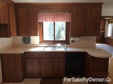 Kitchen
						:
						Taken from living room. Window above sink looks out on backyard patio.