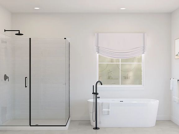 Primary bath with freestanding tub glass shower enclosure