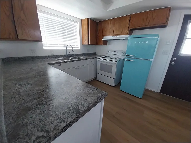 New countertops, stove/oven and retro fridge.
