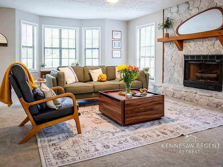 This newly remodeled space is a masterclass in mid-century modern design. Clean lines, natural light, and carefully selected pieces come together to form an elegant and functional living area.