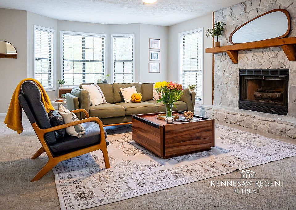 This newly remodeled space is a masterclass in mid-century modern design. Clean lines, natural light, and carefully selected pieces come together to form an elegant and functional living area.