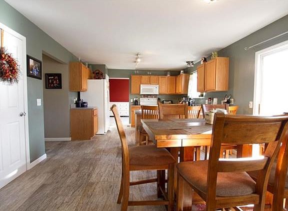 From the breakfast nook you can see all the way through the kitchen to the formal dining area.