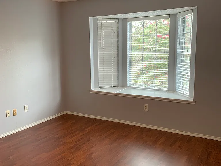 Master bedroom with bay window.