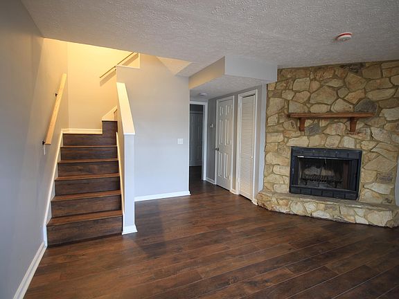 Spacious living room with a charming (non-functional) fireplace