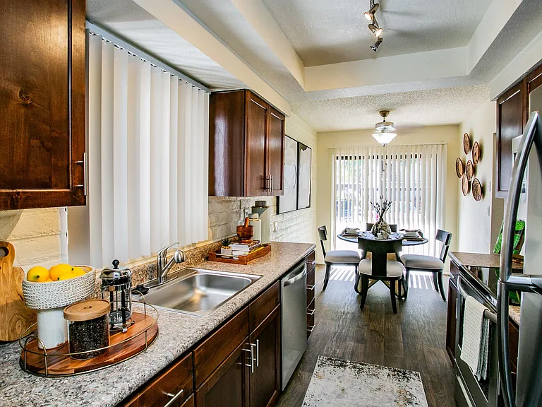 Kitchen with Refrigerator, Dishwasher, and Disposal