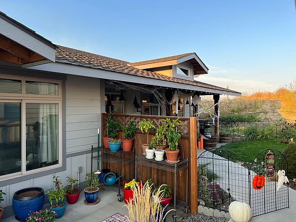 Walkway/entrance to condo with privacy fence and gated front yard.