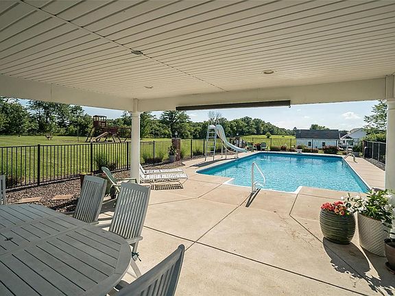 Gazebo has recessed lighting and pre wired for ceiling fan, lighting surrounds the pool.