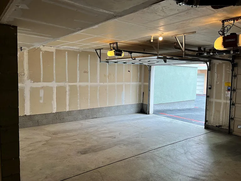 one car garage space with a remote