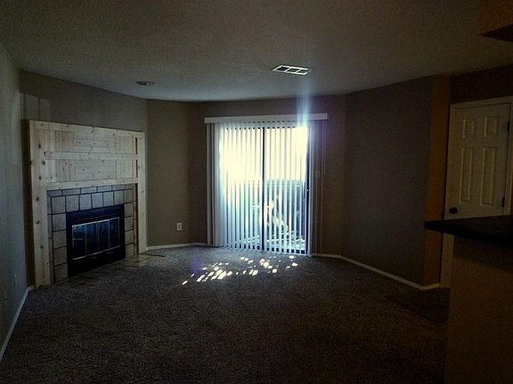 Woodburning fireplace & patio door.