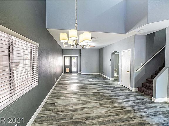 Spacious dining area with high celling and ample lighting