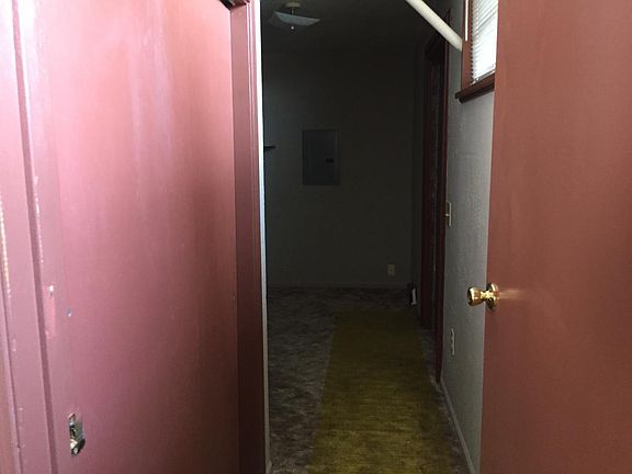 Hallway to back door and bedroom