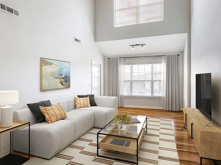 Renovated Package I living room with hard surface flooring
