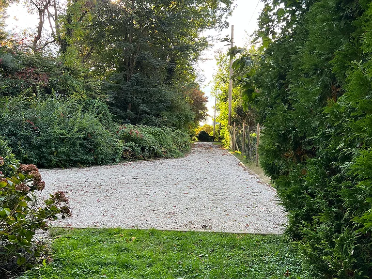 Shell driveway leading to the East Bay bike path and Narragansett Bay.