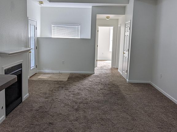view from kitchen area, thru living area, door at end of hall is second bedroom