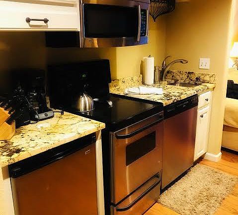 kitchenette (dishwasher, disposal, oven/stove top, mini fridge, microwave, icemaker )