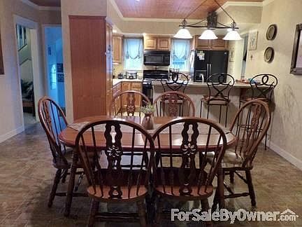 Dining Room / Kitchen
						:
						Renovated dining room and kitchen viewed from family room.