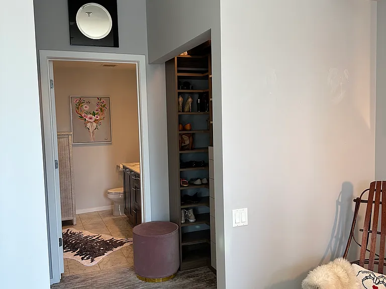Master bedroom is equipped with custom built in closets into bathroom