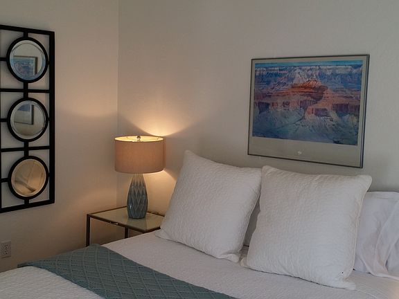 Second bedroom with Queen bed and large, empty closet.
